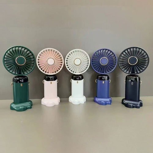 Mini ventilateur à main Fraîcio pliable tenu dans une main